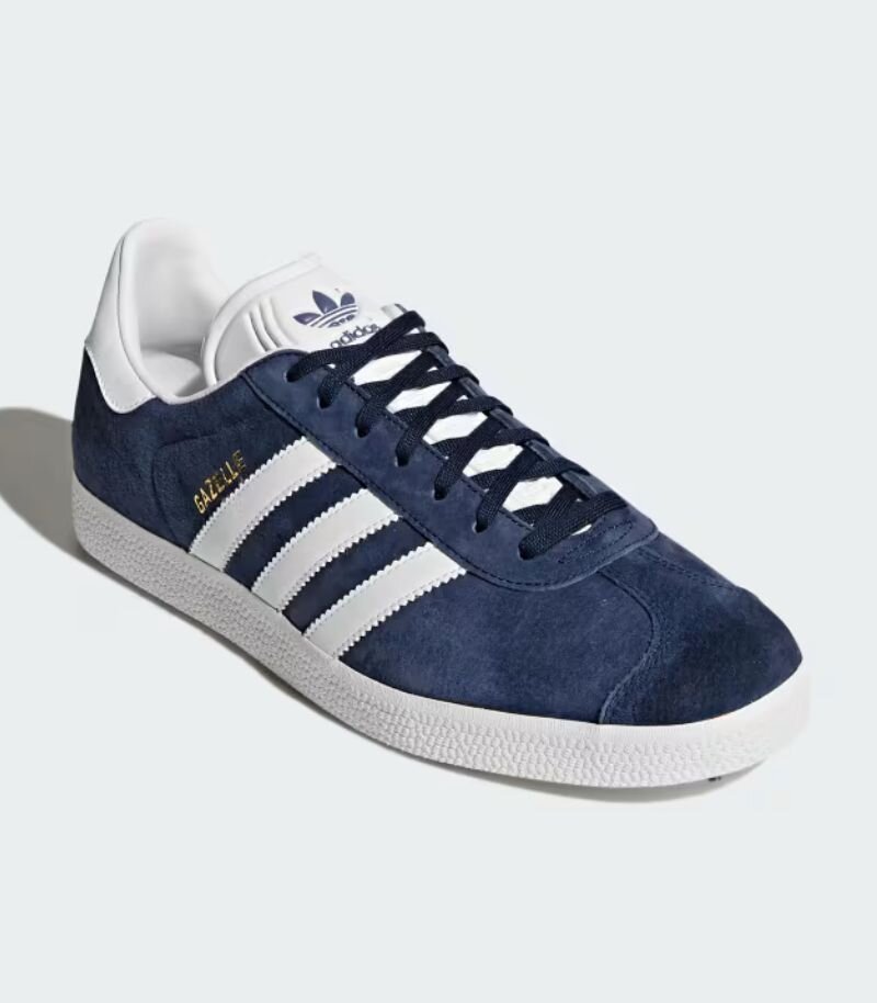 Navy blue adidas gazelle with white branding and sole 